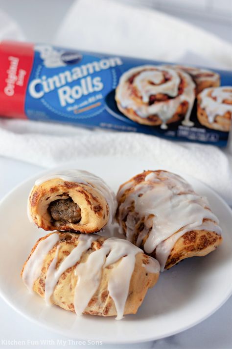 For a sweet and savory twist on a breakfast classic, make this fun Cinnamon Roll Wrapped Breakfast Sausage recipe. Cinnamon roll dough wrapped around a sausage and baked until golden brown then drizzled with frosting, a wonderful morning treat! #breakfast #cinnamonroll #sausage #pigsinablanket #easyrecipe Cinnamon Sausage Rolls, Breakfast With Link Sausage, Sausage Wrapped In Cinnamon Rolls, Sausage Cinnamon Roll Casserole, Cinnamon Roll Wrapped Sausage, Cinnamon Roll Sausage Rolls, Sausage Cinnamon Rolls, Breakfast Pigs In A Blanket Recipe, Breakfast Pigs In A Blanket