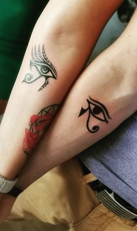 100 Trendy Eye of Horus Tattoos and Meanings - Tattoo Me Now Ankh Eye Of Horus Tattoo Women, Eye Of Ra And Horus Tattoo, Ra And Horus Tattoo, Couple Symbols, Eye Of Horus Tattoo Feminine, Eye Of Horus Tattoo Design, The Eye Of Horus Tattoo, Eye Of Ra Tattoo, Eye Of Horus Tattoo