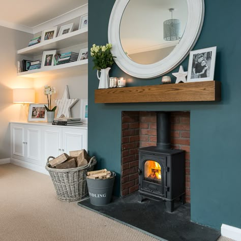 This cosy room has the chimney breast painted in Farrow and Ball Inchyra Blue Living Room Chimney Breast, Living Room With Chimney, Room With Chimney, Living Room Chimney, Chimney Breast Ideas, Alcove Ideas Living Room, Wood Burning Stoves Living Room, Log Burner Living Room, Feature Wall Living Room