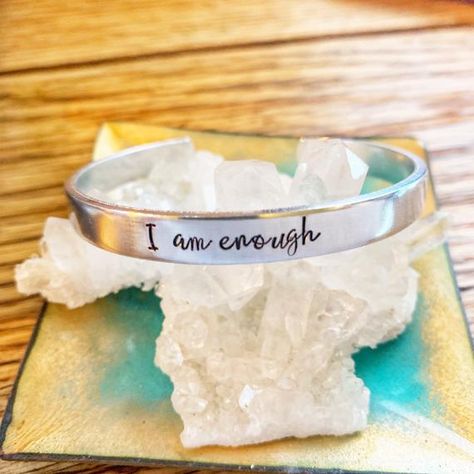 This cuff bracelet is hand stamped with “I am Enough”. • Handcrafted from your choice of .925 sterling silver, 14k rose gold filled, 20k rose gold filled, alumimum, copper, or Nugold (brass) • Measures 1/4th of an inch by 6 inches • Each piece is unique having been shaped and Handstamped by the Healing Vibes, Recovery Gifts, I Am Enough, You Are Enough, Stone Design, Etsy Handmade, Metal Stamping, Womens Jewelry Bracelets, Self Care