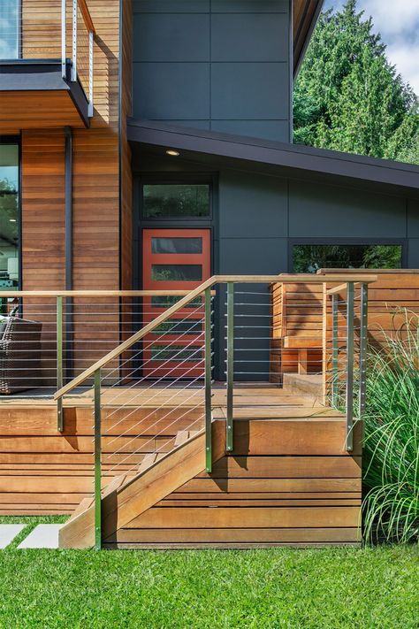 From porches, to decks, this home has a variety of outdoor spaces, covered and uncovered. #decks #customresidentialremodel #homeremodel #frontentry #boardandvellum Platform Deck Front Porch, Wood Over Concrete Porch Front Steps, Front Entry Deck, 1900 Staircase, Deck Ideas Off Back Of House, Stairs To Front Door, Front Stairs Ideas Exterior, Front Deck Ideas Entrance, Front Porch Deck Ideas