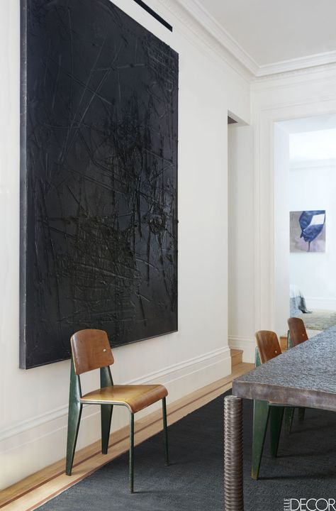 A painting by Rashid Johnson in the same room; the custom jute rug is from Lawrence of La Brea, and the walls throughout the apartment are painted in Farrow & Ball's All White. Persian Palace, Prouve Chair, Field Paintings, Clements Design, Rashid Johnson, Farrow & Ball, Black Painting, New York City Apartment, Dark Artwork