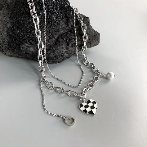 Dare to be different with our checkerboard heart necklace.A perfect balance of chic and daring.🤍🖤 our layered unisex necklace with a bold checkered heart charm. Make a statement that’s uniquely yours!🤎 Stainless steel Waterproof Hypoallergenic . #menjewelry #unisexjewelry #trendyjewelry #stainlesssteeljewelry #waterproofjewelry #kurkuki Dare To Be Different, Unisex Necklace, Waterproof Jewelry, Unisex Jewelry, Be Different, Trendy Jewelry, Stainless Steel Jewelry, Heart Charm, Heart Necklace