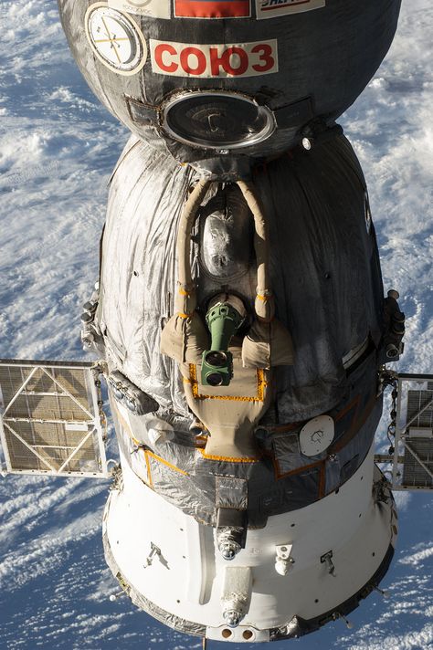 A Russian Soyuz spacecraft is seen docked to the International Space Station, as photographed by one of the Expedition 39 crew members aboard the orbital outpost. [Read the Full Story Here] [Read the Full Story Here] Soviet Space Program, Soyuz Spacecraft, Nasa Photos, Space Stuff, Space Race, Spaceship Design, Nasa Space, Astronauts In Space, International Space Station