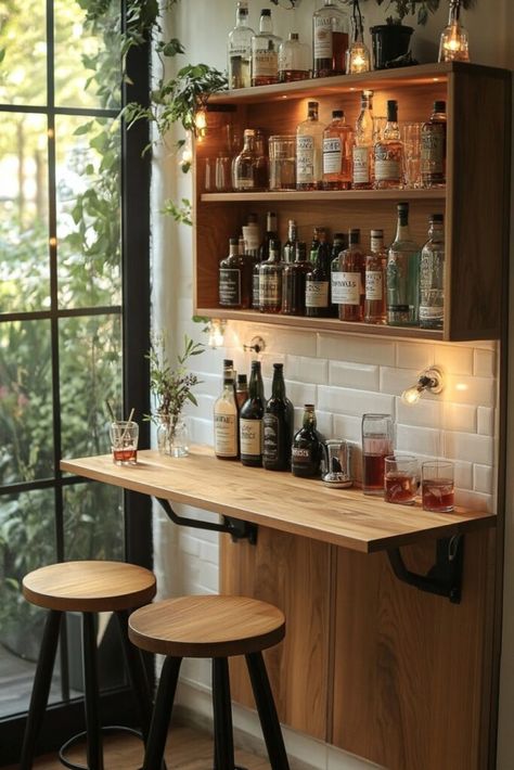 Install a wall-mounted bar with high stools and shelves for an efficient, stylish outdoor entertaining area. Discover more tiny apartment patio ideas for hosting here! Small Bar On Wall, Tiny Bars Small Spaces, Small Bars For Home Apartments, Dining And Bar Area, Kitchen Bar Small Space, Wall Mounted Bar Table, Apartment Bar Set Up, Small Wall Bar Ideas, Bar Attached To Wall