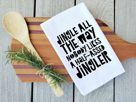 "FUNNY CHRISTMAS TEA TOWEL - \"Jingle all the way nobody likes a half assed jingler\" PRODUCT DETAILS Size: Full Tea Towel - 28\" x 28\"; Design Area - 12\" x 16\"; (Folded Tea Towel) - 6.5\" x 13.5\" Material: 100% Cotton Flour sack towels are highly absorbent, long-lasting, and dry quickly Printing Method: DTG Care: Machine Wash Cold; Tumble Dry Low Heat **Since everything in my store is custom made, some items take a bit longer to make. This item takes about 3-5 business days to process. The production times can be longer during holiday seasons such as Valentines Day, Mothers Day, Fathers Day, and Christmas. Printed and shipped from the USA. **Items leave the facility by the 'ship by' date listed on your invoice. **Each item is made to order, so it is not sitting on a shelf waiting to s Cricut Christmas Tea Towels, Christmas Dish Towels Diy, Funny Christmas Towels, Dish Towels Diy, Screen Printing Projects, Cricut Quotes, Tea Towels Diy, Funny Tea Towels, Holiday Tea