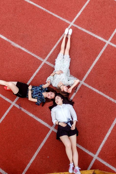 Person Lying On The Floor, Brown Floor, People Pictures, Human Figures, Brown Floors, Three Women, People Women, Person Sitting, Human Figure