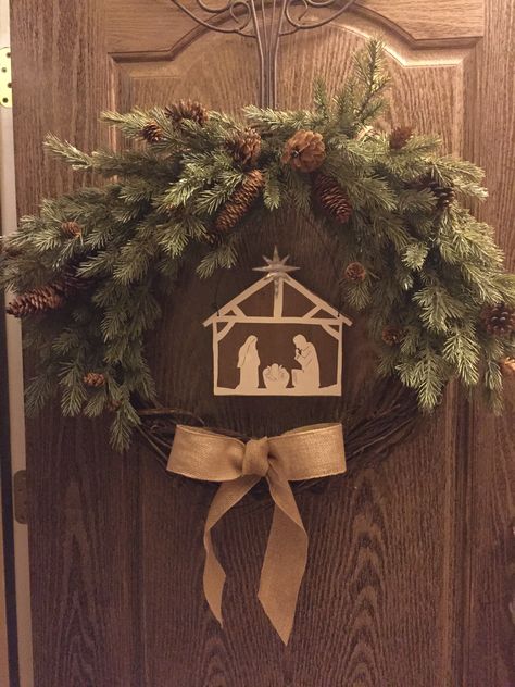 DIY Grapevine Christmas wreath. Garland/twigs with pine cones, Grapevine wreath, burlap ribbon, and a center decor of choice. I found the Nativity. Floral wire to make the twigs stay in place. Manger Wreath Diy, Diy Nativity Wreath, Christian Christmas Wreath, Nativity Wreath Diy, Christmas Wresth, Catholic Christmas Decorations, Woodland Christmas Theme, Christian Christmas Decor, Sliding Gate Design