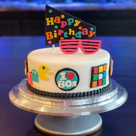 Shelli Smith on Instagram: “80s themed birthday cake for a grad school friend. This one was a fun one to make, love it when I get to be creative! (Scroll for a 360…” 80s Birthday Party Theme Cake, 1983 Birthday Cake, 80s Birthday Cake Ideas, 80s Bday Cake, 80s Theme Cake, 80s Birthday Cake For Women, 80s Theme Cake Birthdays, 80s Themed Cake, 80s Cake Ideas