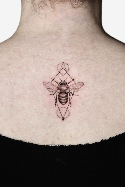 Geometric bee tattoo on the back Bee Chest Tattoo Men, Bee Geometric Tattoo, Bee Tattoo Black And White, Geometric Tattoo Ideas, Tattoos For Ladies, Wasp Tattoo, Bee Outline, Small Bee Tattoo, Bee Tattoos