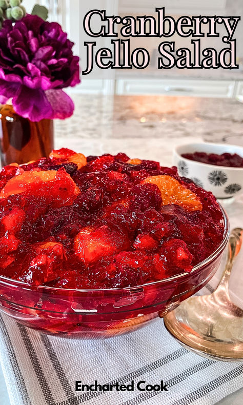 A bowl for cranberry and mandarin orange fruited jello ready to be served with a large spoon. Cranberry Recipes With Canned Cranberry, Cranberry Salad With Mandarin Oranges, Easy Cranberry Jello Salad, Cranberry Strawberry Jello Salad Crushed Pineapple, Orange Cranberry Salad, Cranberry Sauce Jello Salad, Cranberry Congealed Salad Recipes, Jellied Salad Recipes, Cranberry Orange Relish Thanksgiving