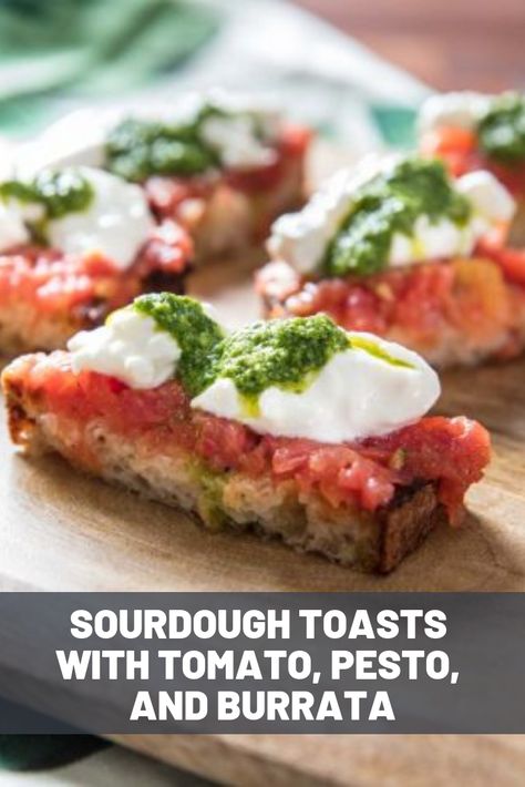 Sourdough Toasts With Tomato, Pesto, and Burrata | These toasts are equal parts easy and delicious. Crisped slices of sourdough are topped with burrata and grated ripe tomatoes, then drizzled with a creamy, bright, herbal pesto.  #newyearseve #appetizers #partyfood #cocktailparty #seriouseats #recipes Pesto And Burrata, Appetizer Crostini, Burrata Tomato, Summer Tomato Recipe, Burrata Recipe, Summer Starter, Sourdough Toast, Arugula Pesto, Tomato Bruschetta