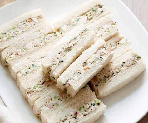 These traditional finger sandwiches combine cooked chicken, creamy mayonnaise, crunchy walnuts and celery for delight to all the senses. Ribbon Sandwiches, Lunch Sandwich Recipes, High Tea Food, Tea Party Sandwiches, Tea Sandwiches Recipes, Afternoon Tea Recipes, Sandwich Bar, Party Sandwiches, Deli Sandwiches