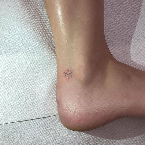 Snowflake Tattoo Ankle, Cute Snowflake Tattoo, Snowflake Tattoo Fineline, Small Snowflake Tattoo Wrist Snow Flake, Tattoo Ideas Snowflake, Mini Snowflake Tattoo, Snowflake Fine Line Tattoo, Snowflake Finger Tattoo, Minimalist Snowflake Tattoo