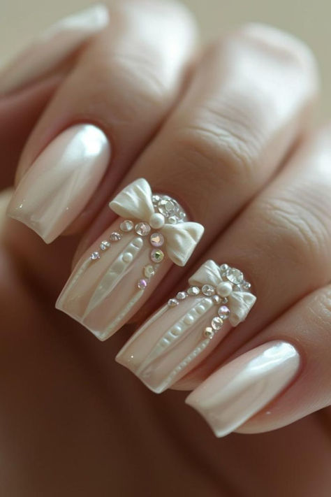 Feminine Ribbon Accent Bridal Nails Pearly White Wedding Nails, Vintage Wedding Nails For Bride, Bride Nails 2024, Country Wedding Nails For Bride, Nail Bride Wedding, Nail Wedding For Bride, Wedding Anniversary Nails Ideas, Wedding Nails For Bride Pearl, Bridal Nail Art Designs Wedding Day