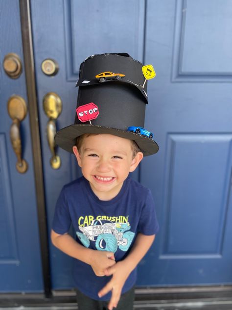 Black hat made with cars and cardboard, easy way to show your hat for hat day Dress Up Hats For Boys, Cardboard Hat Diy, Creative Hats For Kids Boys, Silly Hats For Kids Diy, Handmade Cap-style Hat For Costume, Crazy Hat Day Ideas For Kids, Car Hat, Crazy Hat, Crazy Hat Day