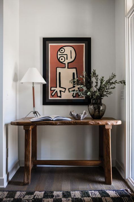 Abstract art and traditional decor pieces marry for a unique vignette in this Golden Valley home, while a playful pairing of a bold wall covering and mirror in the powder bath adds a touch of whimsy.  See more from this project by Yond Interiors below.  📸: Amanda Marie Birnie Playful Interior Design, Yond Interiors, Playful Interior, Modern Remodel, Console Styling, Modern Colonial, Vintage Dining Chairs, Interior Photography, Interior Design Services