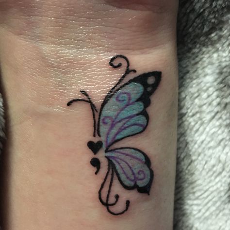 My concept of the semi colon tattoo along with the butterfly project. 🦋❤ #tattoo #semicolonproject #butterflytattoo Semi-colon Tattoo Color, Fairy Semicolon Tattoo, Colin Tattoo Semi, Teal And Purple Semicolon Tattoo, Small Tattoos Butterfly Semicolon, Semi Colon Cover Up Tattoo, Butterfly Semi Colon Tattoos For Women, Semi-colon Butterfly Tattoo Simple, Butterfly And Semicolon Tattoo