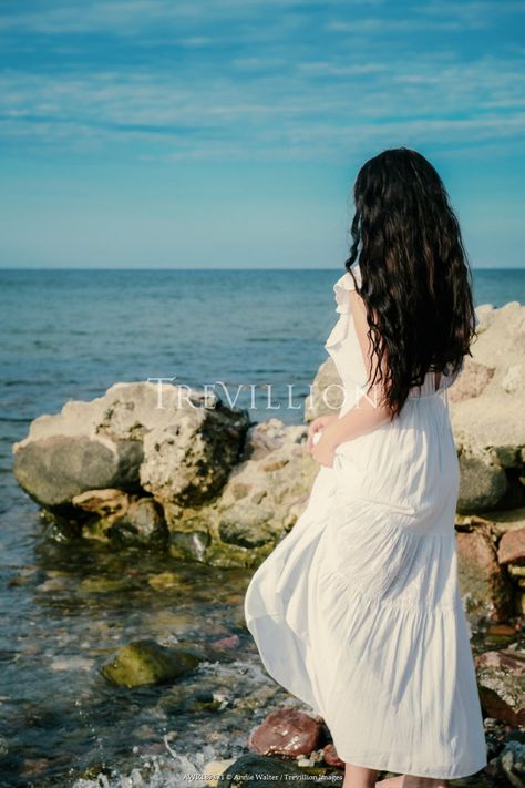 Young woman in white dress by rocks on beach by Annie Walter © Trevillion Images. Rocks On Beach, Trevillion Images, Woman In White Dress, Woman In White, On Beach, Latest Images, Woman Beach, Us Images, Photo Reference