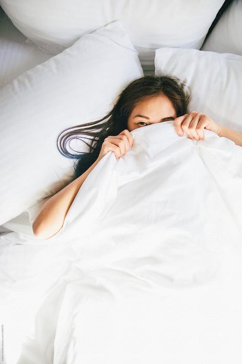 Young Woman Hiding Under Blanket In Bed | Stocksy United Home Photoshoot Woman, Hiding Under Blanket, Under Blanket, Bedroom Photography, Home Photoshoot, Home Photo Shoots, Creative Photoshoot Ideas, White Sheets, Portrait Photography Poses