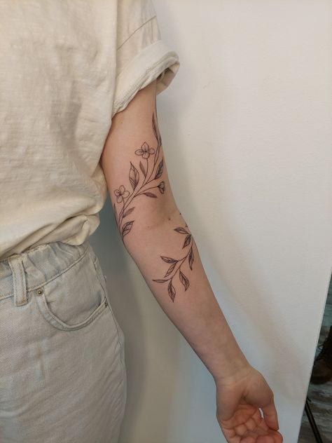 Delicate Floral Wrap Around Tattoo, Flower Tattoo Wrap Around Elbow, Floral Tattoo Around Arm, Ivy Tattoo Around Arm, Flower Tattoo Around Elbow, Best Friend Vine Tattoo, Flower And Butterfly Wrap Around Tattoo, Leafy Vines Tattoo, Fine Line Vine Tattoo Sleeve