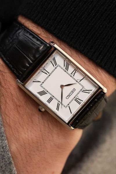 Elevate your style with the SEIKO Essentials Watch for Men. Featuring a sleek rectangular stainless steel case, this water-resistant timepiece combines durability with elegance. The classic leather strap adds a touch of sophistication, making it perfect for any occasion. Discover timeless craftsmanship and everyday versatility in one essential watch! "This post contains affiliate links." #oldmoney #vintagewatches #seiko #tankwatches #fashion #mensfashion #classy Seiko Essentials Watch, Seiko Essentials, Classy Watch, Watch For Men, Classic Watches, Mens Essentials, White Dial, Classic Leather, Wrist Watches