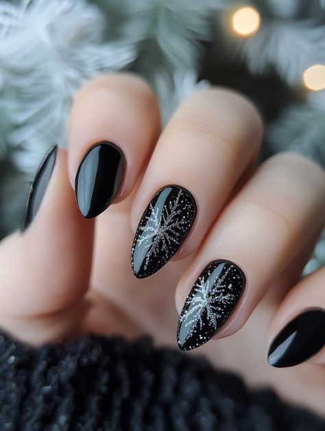 Indulge in the allure of 19 chic black Christmas nail ideas that prove dark can be merry. These designs offer a stylish alternative to traditional festive colors, blending holiday motifs with edgy elegance. Learn how to incorporate glitter, metallic accents, and intricate patterns for a unique and eye-catching seasonal manicure. Black And Metallic Nails, New Years Nail Designs Short, Minimalist Holiday Nails, Alternative Christmas Nails, Black Christmas Nail Designs, Black Friday Nails, Black Christmas Nails, Gold Holiday Nails, Alternative Nails