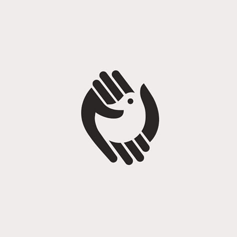 Comment: The use of negative space is classic while being bordered by the encompassing hands. Negative Space Logo Design, App Logo Design, News Logo, Negative Space Design, Behance Design, Negative Space Logos, Inspiration Logo Design, Logo Hand, Logo Luxury