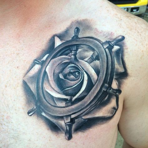 Austin's new tattoo. Ship wheel in the rose. Done by Tj at Underworld in Salem, NH. Ship Wheel Tattoo Design, Tug Boat Tattoo, Pirate Ship Wheel Tattoo, Anchor And Wheel Tattoo, Pirate Wheel Tattoo, Anchor And Wheel Tattoo Couples, Ship Wheel Tattoo, Wheel Tattoo, Left Arm Tattoos