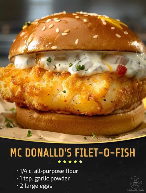 Mc Donalld's Filet-O-Fish  ￼  Ingredients :  2 large eggs 1/4 c. all-purpose flour 1 tsp. garlic powder Kosher salt Freshly ground black pepper 2 c. panko  2 (8-oz.) boneless, skinless white fish filets, such as cod or tilapia, halved crosswise Peanut or vegetable oil, for frying 4 potato buns, lightly toasted 4 slices American cheese Store-bought or homemade tartar sauce, for serving  Directions :  In a shallow bowl, whisk eggs, flour, mustard, garlic powder, 1/2 teaspoon salt, and 1/4 teaspoon pepper. Place panko in another shallow bowl. Season fish all over with salt and pepper. Into a large heavy skillet, pour oil to a depth of 1/4". Heat over medium-heat until shimmering. Coat each piece of fish with egg mixture, then dip into panko, gently pressing to adhere. Fry fish, turning halfwa Filet O Fish Recipe, Filet O Fish, Fish Sandwich Recipes, Homemade Tartar Sauce, Mix Drinks, Fish Sandwich, Fish Recipe, Family Cookbook, Seafood Dinner