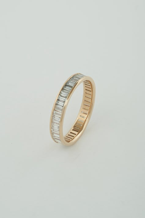 The North South Baguette Band is a channel set band composed of north-south facing white diamond baguettes. The band is eternity style, which means diamonds wrap around the entire exterior of the band. A little deco, a touch modern, this piece is perfect to tie a stack of rings together, compliment a vintage engagement ring, or really stand out on its own. Our Baguette pieces are made with recycled natural diamonds. All diamonds are G-H Color, and VS Clarity. Bands can be matched to a center sto Baguette Diamond Wedding Band, Baguette Band, Baguette Wedding Band, Stacked Wedding Bands, Baguette Diamond Rings, North South, Put A Ring On It, Emerald Engagement Ring, Channel Set