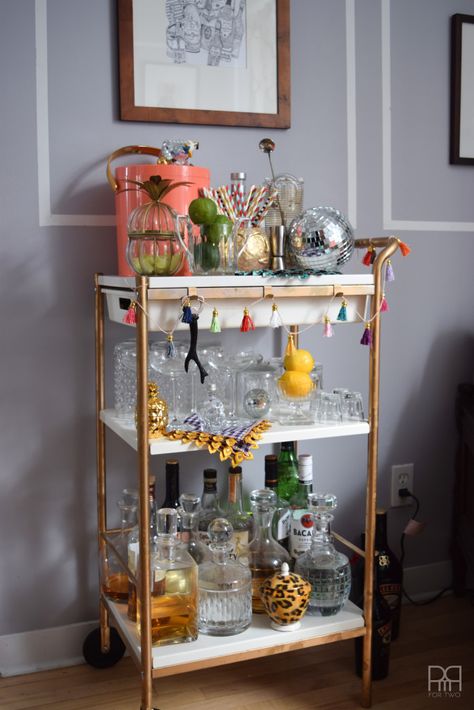 Tips for building and styling your home bar like a professional. Your next cocktail hour will be a smashing success! Tassel Garland Tutorial, Cocktail Corner, Home Cocktail Bar, Bar Rail, Bar Cart Styling, Cocktail Glassware, Bar Cart Decor, Home Bar Decor, Bar Glassware