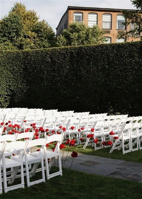 Imagine being led down the aisle by these exquisite red roses surrounded by a picturesque garden setting at this outdoor wedding ceremony. Walking down the aisle accompanied by a live harpist is so elegant. #outdoorweddingceremony #outdoorwedding #weddingceremony #redroses #harpist #weddingmusic #overthemoon #townandcountrymag #theknot #weddingplanner #nycweddingplanner #luxuryweddings #alinatoevents Wedding Aisle Red, Picturesque Garden, Wedding Aisle Outdoor, White Wedding Ceremony, Red Wedding Decorations, Rose Gown, Wedding Isles, Red And White Weddings, Rose Petals Wedding