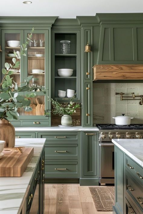 The combination of green cabinets and wood accents in a kitchen is a favorite of mine. The green cabinets bring a sense of nature and tranquility into the space, creating a calming and refreshing atmosphere. When paired with wood accents, the kitchen exudes warmth and a timeless appeal. Olive Green Kitchen With Gold Accents, Butcher Block Island Green Cabinets, Green Earthy Kitchen Aesthetic, Wood Top Cabinet, Two Tone Cabinets Green, Thyme Green Kitchen Cabinets, Olive Green Kitchen Walls Oak Cabinets, Green Kitchen With Brown Countertops, White Oak And Green Kitchen Cabinets