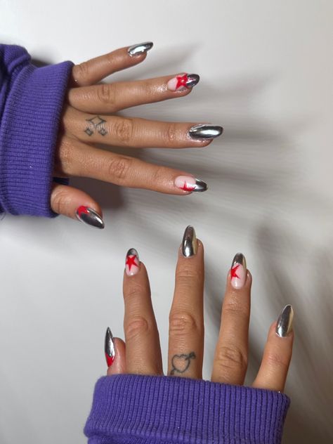 Chrome And Star Nails, Gold Chrome Star Nails, Valentines Nails Y2k, Funky Nails 2024, Harry Inspired Nails, Dark Red Heart Nails, Red And Chrome Nails, Glam Rock Nails, Cool Red Nails