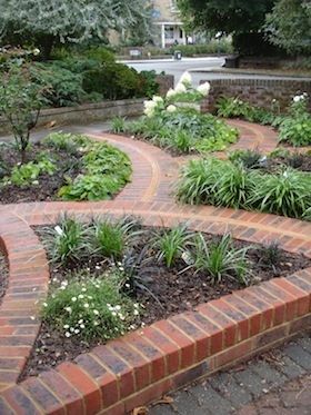 In this art deco front garden design I used stylish art deco curves to injected bold visual movement throughout the plot. Inspiration for the new paths came from the original 1930's tile and brick detail within the front porch pier of the house. 1930s Garden Design, 1930s House Front Garden, 1930s Semi Garden Ideas, 1930s Art Deco House Exterior, 1930s Semi Driveway, Art Deco Front Gate, 1930s Garden, Plot Inspiration, 1930s Doors