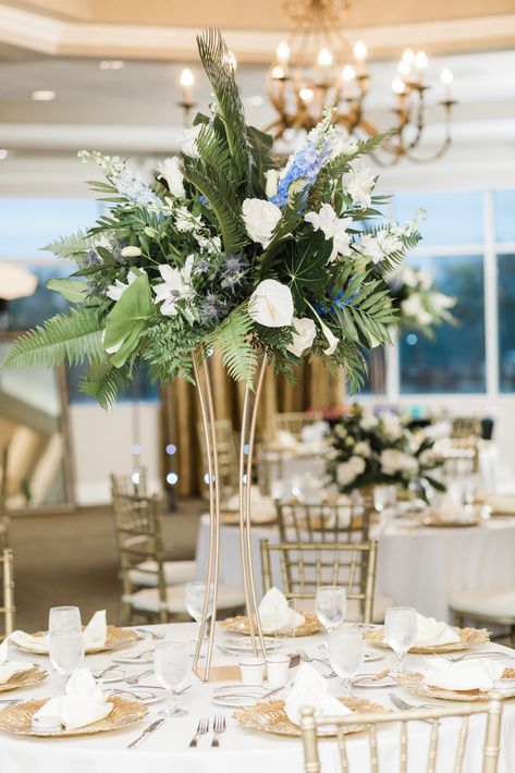 Blue Tropical Wedding Flowers, Blue And White Tropical Wedding, Tall Tropical Centerpiece, Centerpieces With Greenery, Prom Centerpieces, Beach Wedding Centerpieces Flowers, White Wedding Flowers Centerpieces, Tropical Centerpieces, Blue Green Wedding