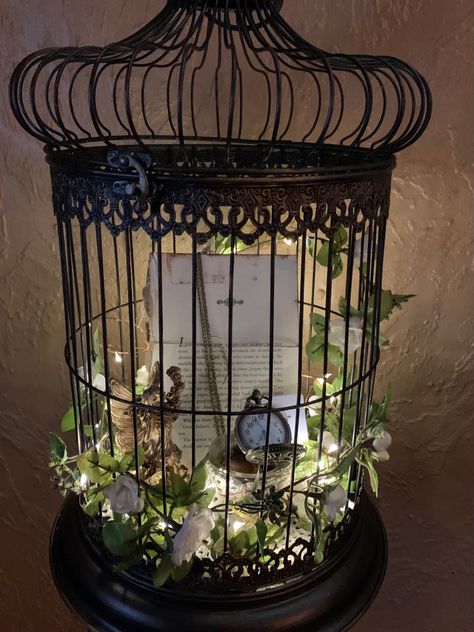 Upcycled from a white bird cage Gothic Birdcage Decor, Black Bird Cage Decor, Vintage Bird Cage Decor Ideas, Antique Bird Cage Decor Ideas, Repurposed Bird Cage Ideas, Decorated Bird Cages, Birdcage Ideas, Bird Cage Ideas, Vintage Bird Cage Decor