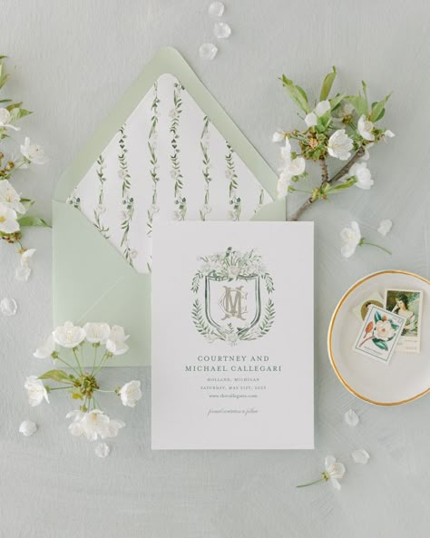 "Our Tulip Blanche Save The Date features a hand-painted watercolor of a crest with white roses, tulips, ranunculus, sprinkled with lush evergreen leaves, and an interlocked monogram. This watercolor is printed on the front of your save the date, with an option of a photo of the happy couple printed on the back. If you would like to add the photo to the back of the card, please purchase this listing as well: https://www.etsy.com/listing/1106154115/add-on-photo-on-backside-of-card?ref=shop_home_a Save The Date Watercolor, Wedding Crest, Timeline Design, Letter Monogram, 3 Letter, Addressing Envelopes, Cream Roses, Wedding Stationary, Ranunculus