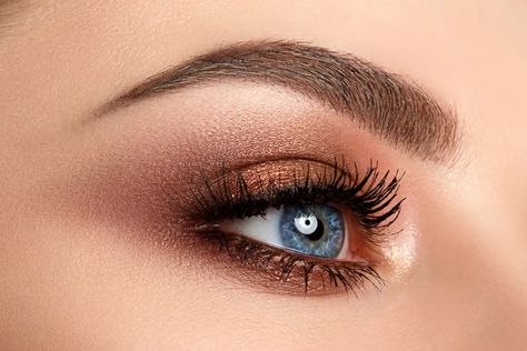 5 Best Eyeshadow Colors If You Have Blue Eyes— Best Life Brown Makeup Blue Eyes, Bronze Eye Makeup Blue Eyes, Eye Shadow For Blue Eyes And Brown Hair, What Color Eyeshadow For Blue Eyes, Blue Gray Eyes Makeup, Best Eyeshadow Colors For Blue Eyes, Simple Eye Makeup For Blue Eyes, Blue Hooded Eyes Makeup, Blue Eyes Eyeshadow Looks