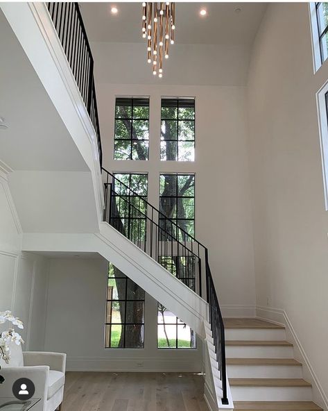 Windows On Staircase Wall, Staircase Window Exterior, Floating Staircase In Front Of Window, Stairs With Windows Stairways, Staircase Window Design Modern, West Indies Home, Staircase Window, Glass Staircase Railing, Modern Entrance Door