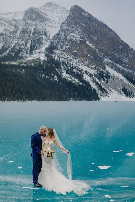 Epic Blue Ice on a freshly frozen Lake Louise makes a stunning backdrop for this winter wedding in the mountains! See more on the blog! Winter wedding inspiration in the Canadian Rocky Mountains. Adventurous winter elopement on newly frozen mountain lake with amazing blue ice. Rare blue ice at Lake Louise for an intimate November winter wedding. Where to get married in the mountains. Emotional outdoor wedding ceremony. Lake Louise Wedding Photographer ENV Photography. Elopement Inspiration. Winter Mountain Wedding, Outdoor Winter Wedding, Fairmont Chateau Lake Louise, Chateau Lake Louise, Mountain Top Wedding, Intimate Wedding Venues, Rocky Mountain Wedding, Emerald Lake, Winter Wedding Inspiration