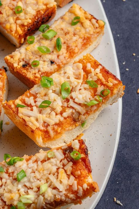 This cheesey gochujang garlic bread is the ultimate appetizer or side dish. It's bursting with flavor and only requires a handful of simple ingredients to make. Once you try it, traditional garlic bread will be a thing of the past! #vegan #garlicbread #gochujang #bread #appetizer Garlic Bread Vegan, Vegan Kfc, Gochujang Paste, Garlic Butter Spread, Vegan Chicken Nuggets, Bread Roast, Savory Bread Recipe, Homemade French Bread, Roasted Garlic Cloves