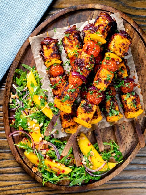 Halloumi kebabs with a delicious and mildly spicy rose harissa glaze and veggies all slid onto skewers and grilled until perfectly cooked. Preparation for these wonderful vegetarian skewers takes a leisurely 15 minutes and cooking them takes less than 10, making this a perfect quick centrepiece for dinner. Vegetarian Skewers, Cheese And Potato Pie, Spicy Rose, Roasted Vegetable Couscous, Moroccan Carrot Salad, Rose Harissa, Cornish Pasty, School Dinner, Cheesy Mashed Potatoes