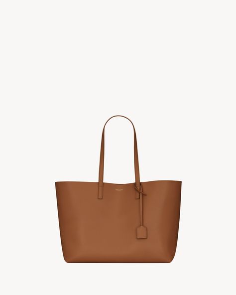 Shopping Saint Laurent leather | Saint Laurent | YSL.com Tan Ysl Bag, Tan Saint Laurent Bag, Ysl Uptown Small Tote, Saint Laurent Shopping Bag, Ysl Tote Bag, Ysl Tote, Saint Laurent Bag. Cheap, Saint Laurent Tote, Crossbody Bags For Travel