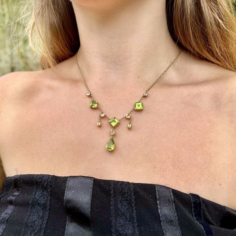 New in and absolutely fabulous! This gorgeous evening emerald piece is sure to turn many heads 💚✨ An elegant antique Victorian peridot topaz lavaliere necklace adorned with three droppers decorated with four lime-green peridots and seven golden-yellow topaz. The sunny gemstones complement each other beautifully and are a combination of square, pear and cushion cuts, weighing between 0.20 – 3 carats each. The stones are held in 15ct gold crown settings and join a fine 15ct cable chain compl... Autumn Court, Peridot Jewelry, Peridot Necklace, Safety Chain, Absolutely Fabulous, Gold Crown, Green Peridot, Golden Yellow, Antique Jewellery