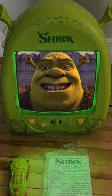 Shrek on a Shrek tv. I love Shrek. Shrek tv. Aesthetic, cute, Shrek Funny Shrine Ideas, Shrek Body Pillow, Shrek Bedroom, Shrek Cursed, Y2k Zine, Shrek Core, Shrek Merch, Shrek Shrine, Fish Wallpaper Iphone