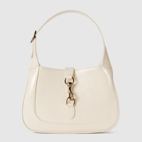 Gucci Jackie small shoulder bag in ivory patent leather | GUCCI® US Gucci Store, Red Web, Crescent Shape, Zip Puller, Gucci Shoulder Bag, Pretty Bags, Cute Purses, Orange Bag, Green And Red