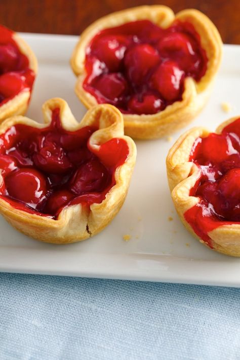 Delicious buttery mini pies with sweet cherry pie filling! Cherry Pie Cups, Cherry Pie Bites, Pie Cups, Mini Cherry Pies, Sweet Cherry Pie, Cherry Pie Recipe, Mini Tarts, Pillsbury Recipes, Pie Bites