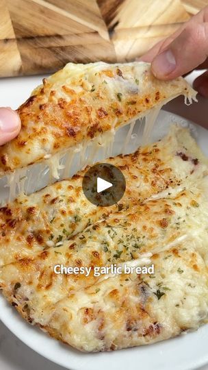 161K views · 15K reactions | Say “YUM” if you would eat this Cheesy Garlic Bread 🥖😋🙌

What you need:
2 low carb tortillas
2 oz cream cheese
1/2 cup shredded mozzarella 
2 tbsp melted butter 
1 tsp garlic, minced
1 tsp chopped parsley 

How to make it:
1. Spread your cream cheese on a tortilla and add half of your mozzarella. Top with the other tortilla.
2. Mix the butter, garlic & parsley and brush on each side of the tortillas.
3. Add your final layer of mozzarella to the top & air fry @ 380F for 8-10 mins.
4. Take it out, serve with more garlic butter and enjoy! | iRick Wiggins Biscuit Snacks, Irick Wiggins, Garlic Cheese Bread, Cheesy Garlic Bread, Cheesy Bread, Low Carb Tortillas, Air Fryer Recipes Easy, Air Fryer Recipes Healthy, Breadsticks